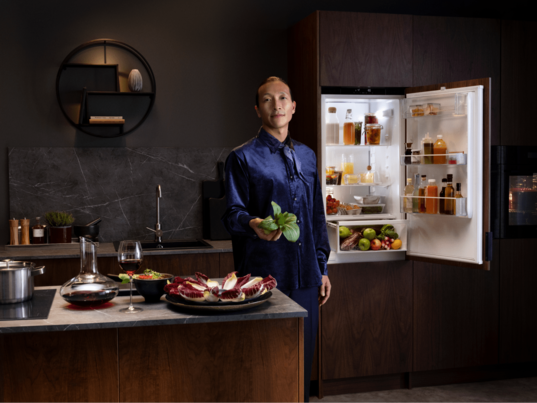 Man next to fridge freezer